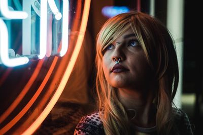 Woman looking through window