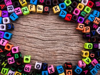 Directly above shot of beads with text on table