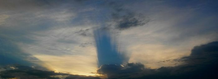 Low angle view of rainbow in sky