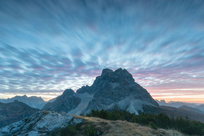 Scenic view of snowcapped mountains against sky during sunset