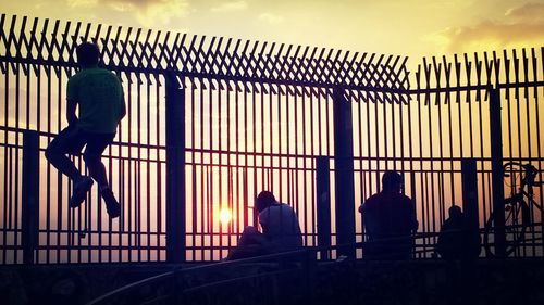 Silhouette people at sunset