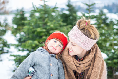 Happy mother and child in winter