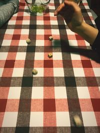 High angle view of person relaxing on tiled floor