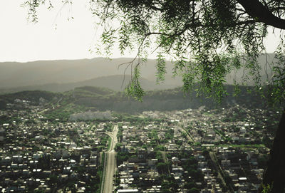 Aerial view of city buildings against sky