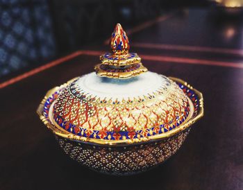Close-up of illuminated tea light candles on table