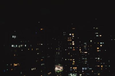 Cityscape against sky at night