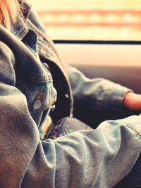 Close-up of man sitting on floor