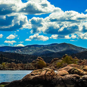 Scenic view of mountains against blue sky