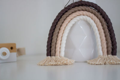 Close-up of shell on table against white background