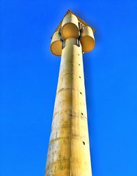 Low angle view of tower against clear blue sky