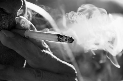 Close-up of man smoking cigarette