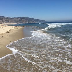 View of beach against clear sky