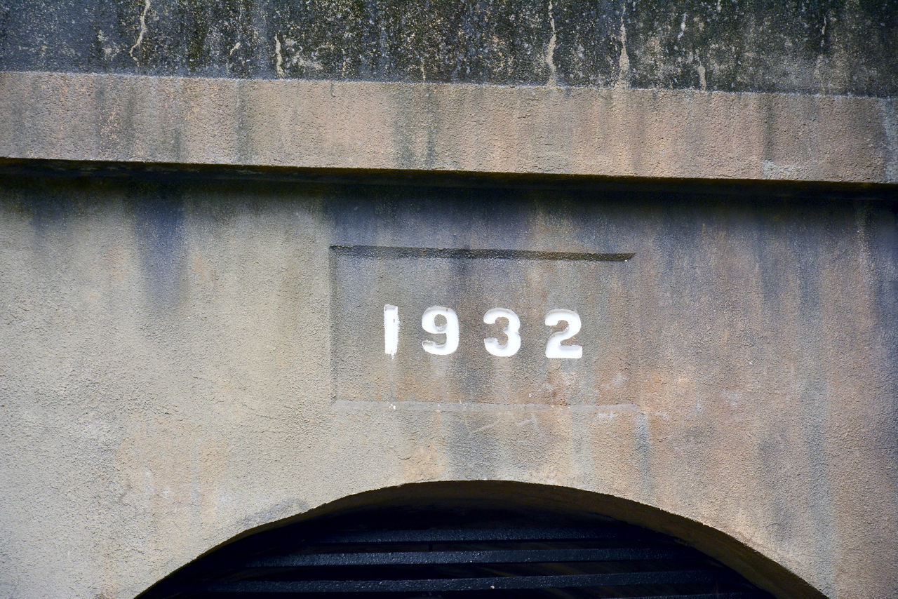 CLOSE-UP OF TEXT ON BLUE WALL