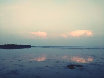 Scenic view of sea against sky at dusk