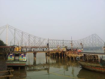 Bridge over river against clear sky