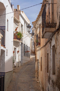 Alley amidst buildings in city