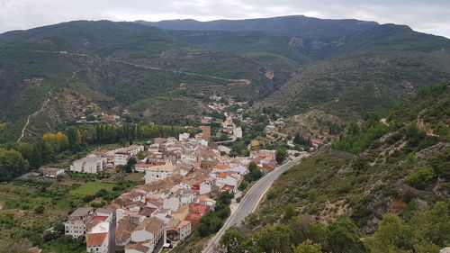 High angle view of townscape against mountain