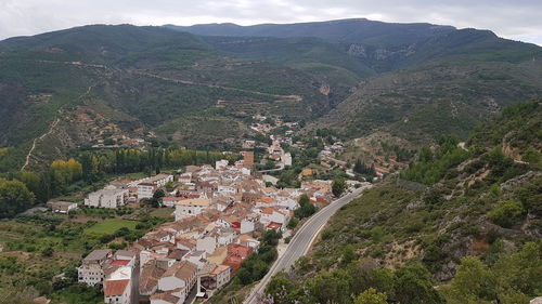 High angle view of townscape against mountain