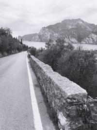 Scenic view of country road passing through mountains
