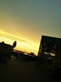 Buildings in city at sunset