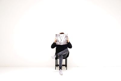 Man standing against white background