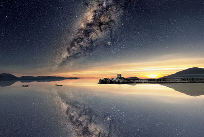 Scenic view of sea against sky at night