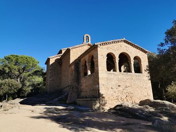 Historic building against clear blue sky