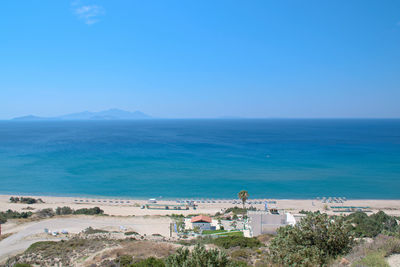 High angle view of sea against blue sky