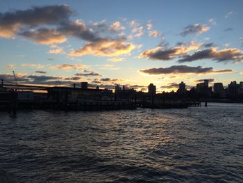 Scenic view of river at sunset