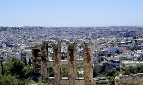 Panoramic view of buildings in city against clear sky