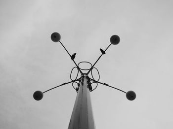 Low angle view of street light against sky