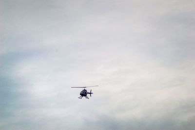 Low angle view of airplane flying in sky