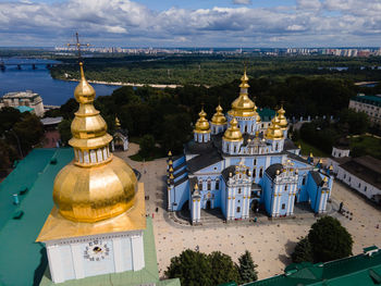 Temple against buildings in city