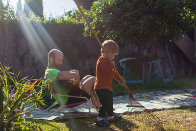 Rear view of children on plants