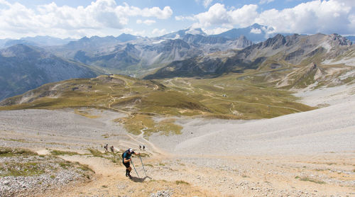 Trail with hiker on the aiguille percée which is a mountain in france located in savoie