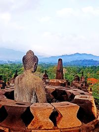 View of temple against cloudy sky