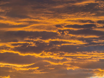 Low angle view of dramatic sky during sunset