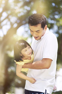 Father and daughter playing at park