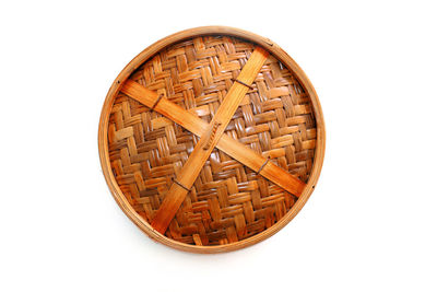 Close-up of wicker basket on white background