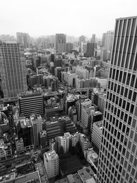 High angle view of buildings in city against sky