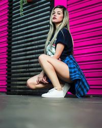 Young woman sitting outdoors