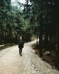 Rear view of woman walking in park