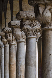 Close-up of old sculpture against building