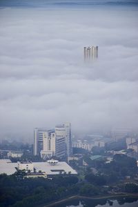 High angle view of buildings in city against sky