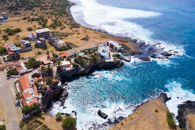 High angle view of buildings by sea