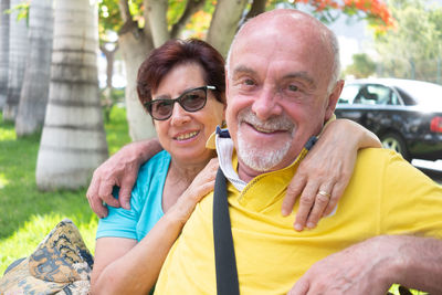 Portrait of smiling man and woman outdoors