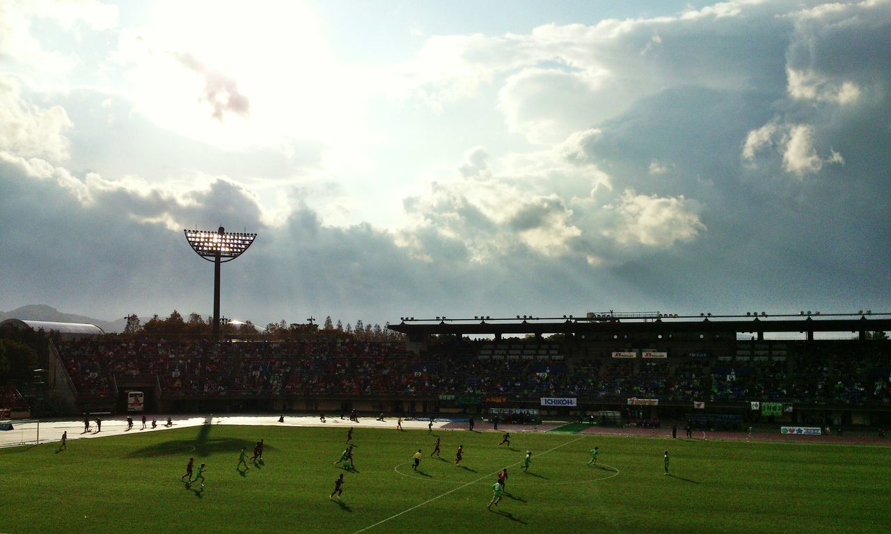 SCENIC VIEW OF SOCCER FIELD AGAINST SKY