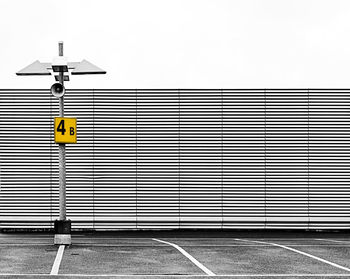 Road sign against clear sky