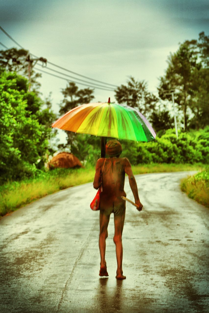 WOMAN WALKING ON ROAD