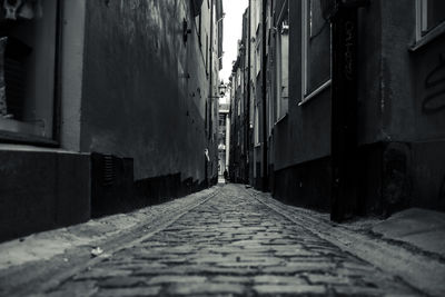 Walkway amidst buildings